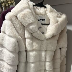 Mid length cream faux fur coat. Apparis brand. New never worn.